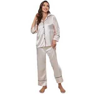 Elegant champagne satin pajama set for women featuring long sleeves and black contrast piping