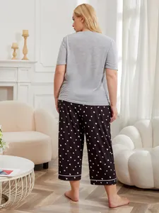 Back view of plus size grey short sleeve pajama set with heart print pants