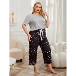 Women's plus size pajama set with short sleeve gray top and heart print long pants