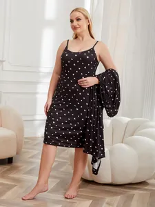 Elegant detailed view of plus size black satin sleepwear set with white heart print pattern