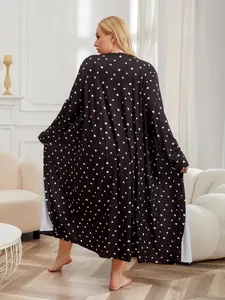 Rear view of plus size black satin robe featuring a delicate white heart print pattern
