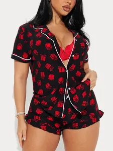 Two-piece women's Christmas pajama set featuring a red gift box print on black fabric