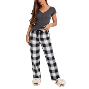 Women's two-piece pajama set with a grey V-neck short sleeve top and plaid pants.