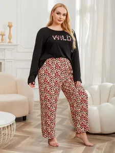 Detail view of plus size long sleeve pajama set with leopard print WILD text