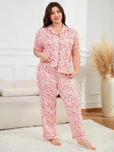 Full view of women's red heart print short sleeve and long pants pajama set on model