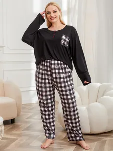 Detailed view of women's plus size black pajama set with heart checkered pants.