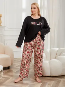 Detail view of plus size pajama set with long sleeve wild top and leopard print pants.