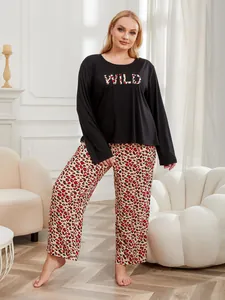 Plus size two-piece pajama set featuring black WILD slogan top and red leopard pants