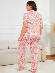 Back view of plus-size women's pajamas set featuring red heart print and short sleeves