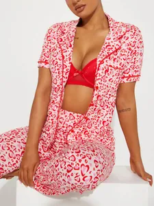 Detailed view of women's red and white heart print pajama set with short sleeves