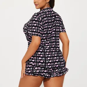 Women's two-piece pajama set featuring pink heart and LOVE print on soft black fabric