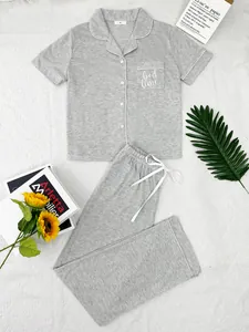 Cozy gray two-piece pajama set with short sleeve top and long pants displayed on white