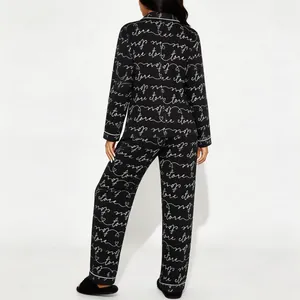 Dames 2-delige zwarte pyjamaset met witte tekstprint, shirt met lange mouwen en broek
