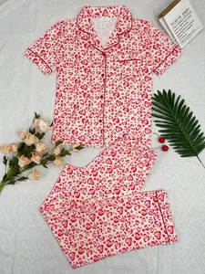 Detailed view of women's heart print pajama set with short sleeves and long pants