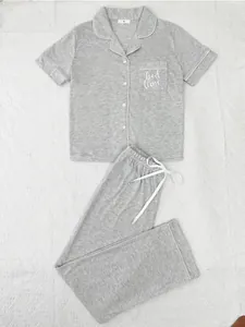 Grey two-piece pajama set with short-sleeve top and long pants featuring bed time embroidery