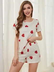 Detailed view of women's heart print pajama set with short sleeves and shorts