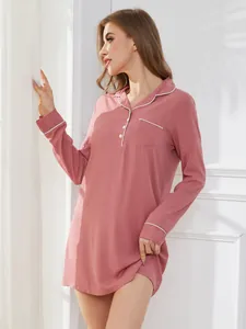 Minimalist pink long-sleeve nightgown with white piping for cozy home loungewear.