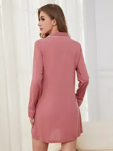 Detailed back view of a pink long-sleeve nightdress featuring elegant white piping details