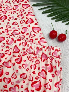 Detailed view of heart leopard print pajamas with soft elastic waistband and cute pattern