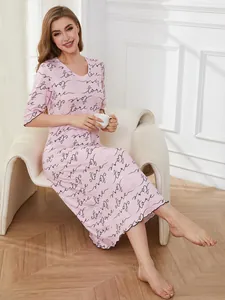 Detailed view of pink V-neck nightgown with elegant heart and letter print design
