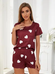 Women's burgundy summer loungewear set featuring white heart print and short sleeves