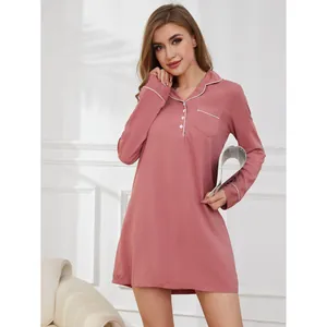 Elegant pink long-sleeved nightdress with white trim and button details for women
