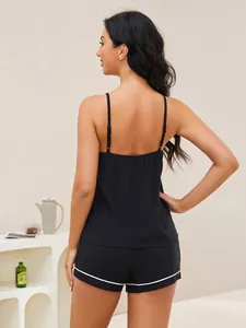 Back view of black sexy pajama set with camisole and shorts featuring white trim