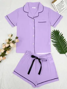 Detailed shot of women's lavender purple ribbed pajama set with button-down top and shorts