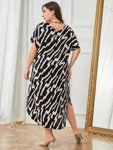 Back view of plus size short sleeve nightgown with abstract zebra pattern and side slit
