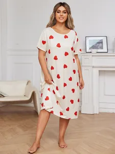 Detailed view of a plus-size heart print short sleeve nightgown in a cozy home setting