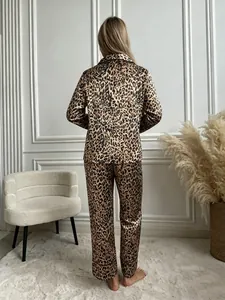 Detailed back view of leopard print silk pajama set for women in elegant interior