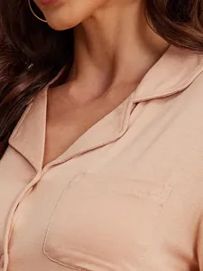 Detailed view showing the soft modal fabric texture, collar, and pocket of women's pajamas.