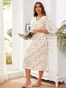 Detailed view of women's short-sleeved nightgown featuring 'Love store' cursive print.