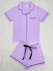 Two-piece purple ribbed pajama set for women with black piping and short sleeves