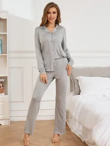 Full-body view of grey modal pajamas set with button-down shirt and long pants