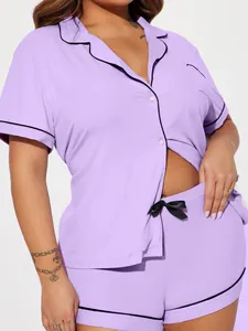 Detail shot of women's lavender ribbed pajama set featuring black piping and a waist bow