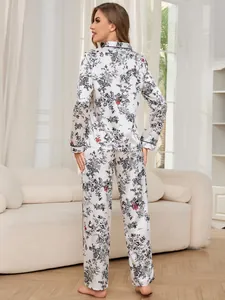 Detailed back view of women's long-sleeve satin pajama set featuring vintage floral print.
