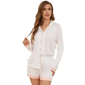 Two-piece modal pajama set for women with long sleeve shirt and pink trim shorts