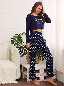 Two-piece navy blue star print pajama set with long-sleeved cropped top and pants