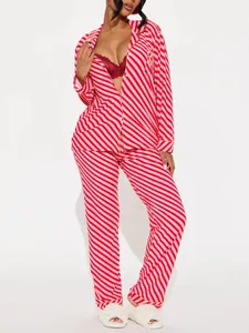 Detail view of women's striped long-sleeve pajama set with pink and red diagonal patterns