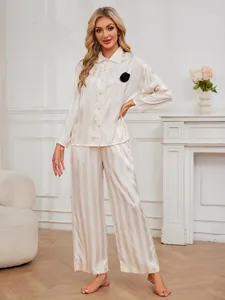 Elegant striped faux silk pajama set for women in champagne with black flower detail