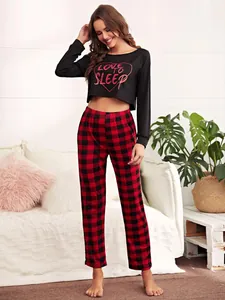 Full length view of two-piece pajama set with love to sleep print top and plaid pants