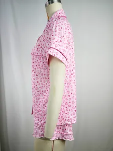Side view detail of women's pink heart print pajama set with short sleeves and lapel