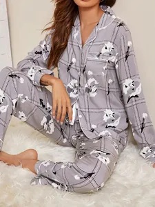Close-up view of a women's grey floral plaid pajama set showing fabric detail and print