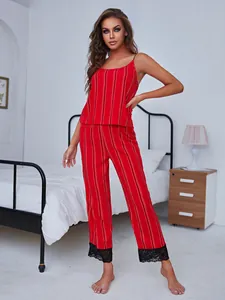 Elegant women's red striped pajama set with camisole top and black lace trim pants