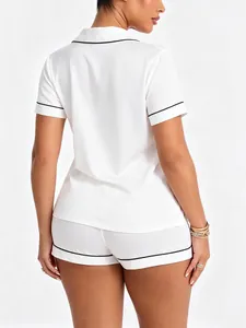 Back view of a white modal pajama set featuring elegant black piping and classic collar