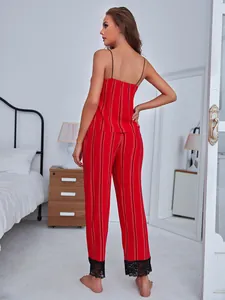 Rear view of a sexy red and white striped camisole and long pants pajama set with lace.