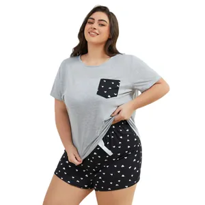 Plus size women's grey pajama set with heart print shorts and cute pocket detail