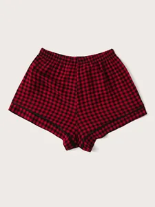 Detailed view of women's red and black checkered buffalo plaid pajama shorts with elastic waist