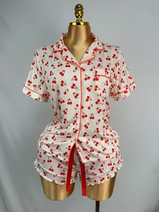 Two-piece cherry print pajama set with short sleeves and ruffled shorts